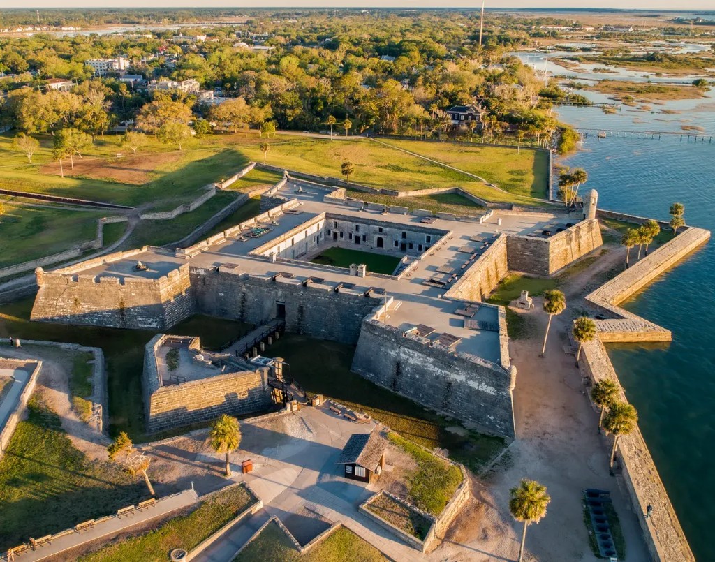 Aerial golden hour view of Castillo de San Marcos star fort in St. Augustine, Florida